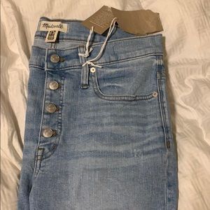 Distressed denim light color jeans